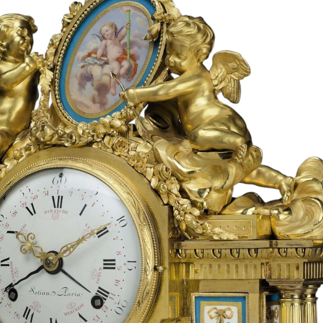 Elegant antique clock adorned with cherubs and intricate golden details.