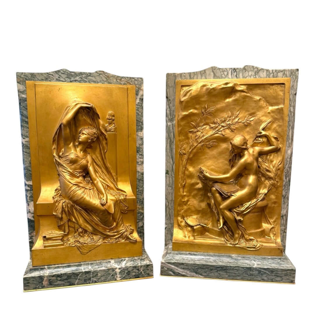 A pair of French gilt bronze relief plaques titled - Antiquité Gallery