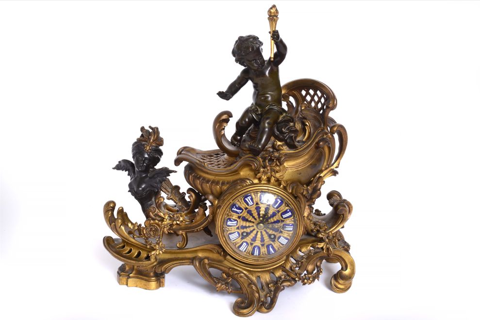 A FRENCH ORMOLU AND PATINATED-BRONZE ‘CHARIOT’ MANTEL CLOCK - Antiquité Gallery