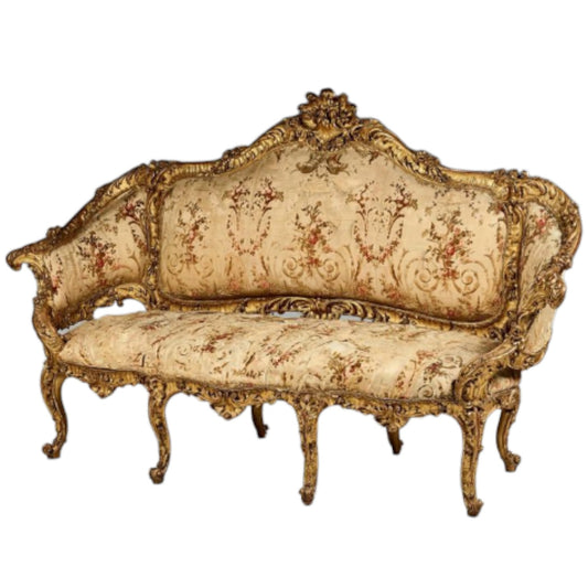 Molded, carved, and gilded wood sofa with rich decoration on all sides - Antiquité Gallery